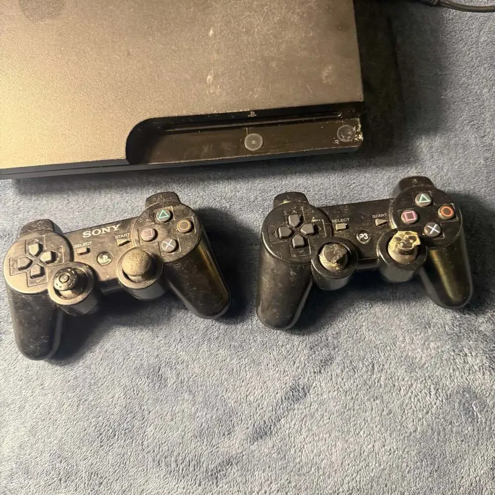 Sony PlayStation 3 Slim CECH-3001A Charcoal Black Console with Two Controllers